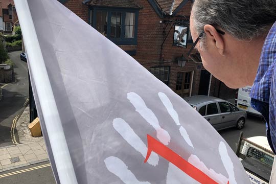 Putting up a flag in arundel